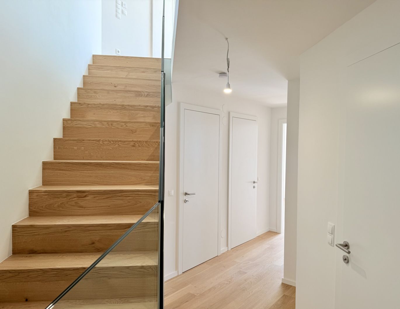 Eleganz trifft Lage - Neubau-Dachgeschosswohnung in Toplage