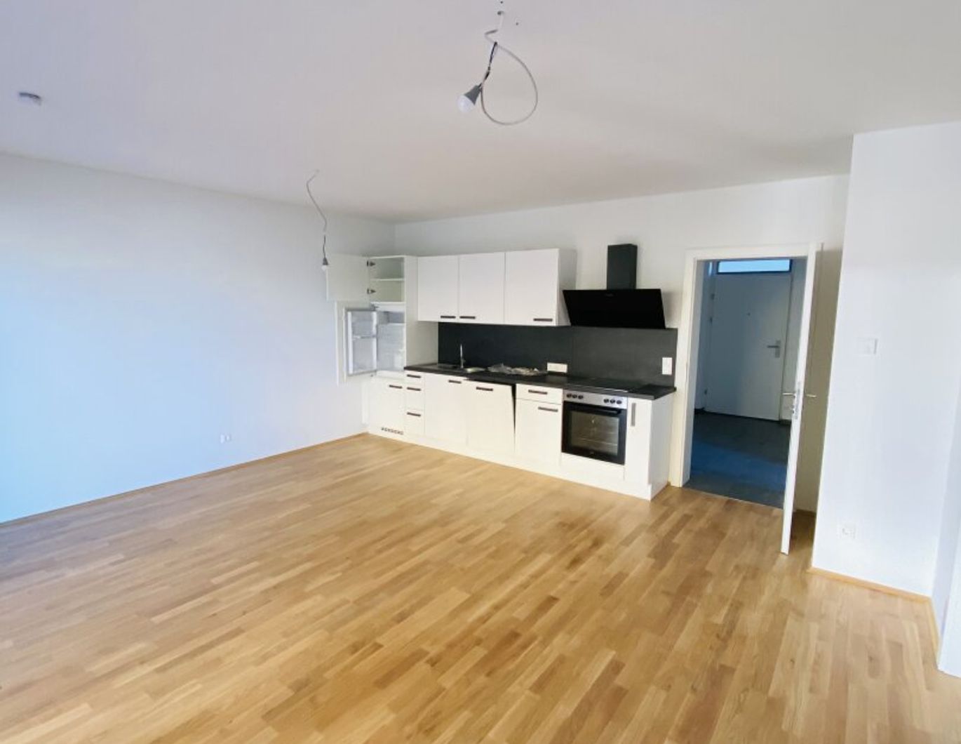 TRAUMHAFTE 3-Zimmer-Neubauwohnung mit herrlichem Balkon, Morgensonne und Tiefgaragenparkplatz