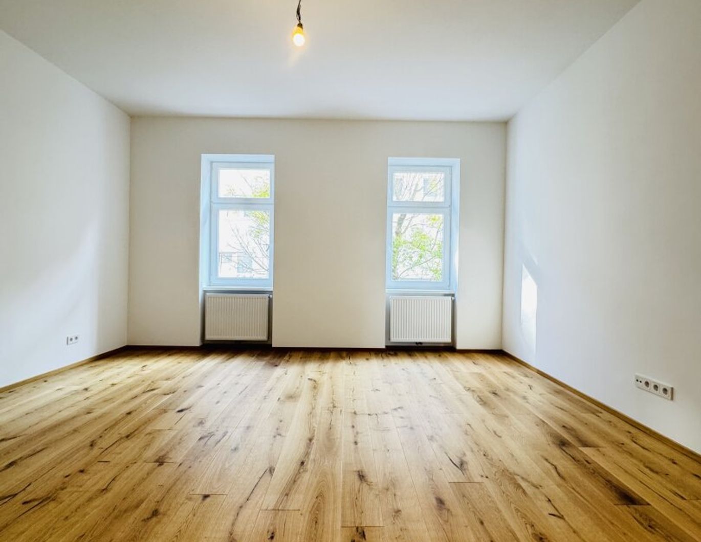Charmante Erstbezugs-3-Zimmer-Wohnung in einem generalsanierten Altbauhaus mit einem eigenen Gartenabteil zur exklusiven Nutzung.