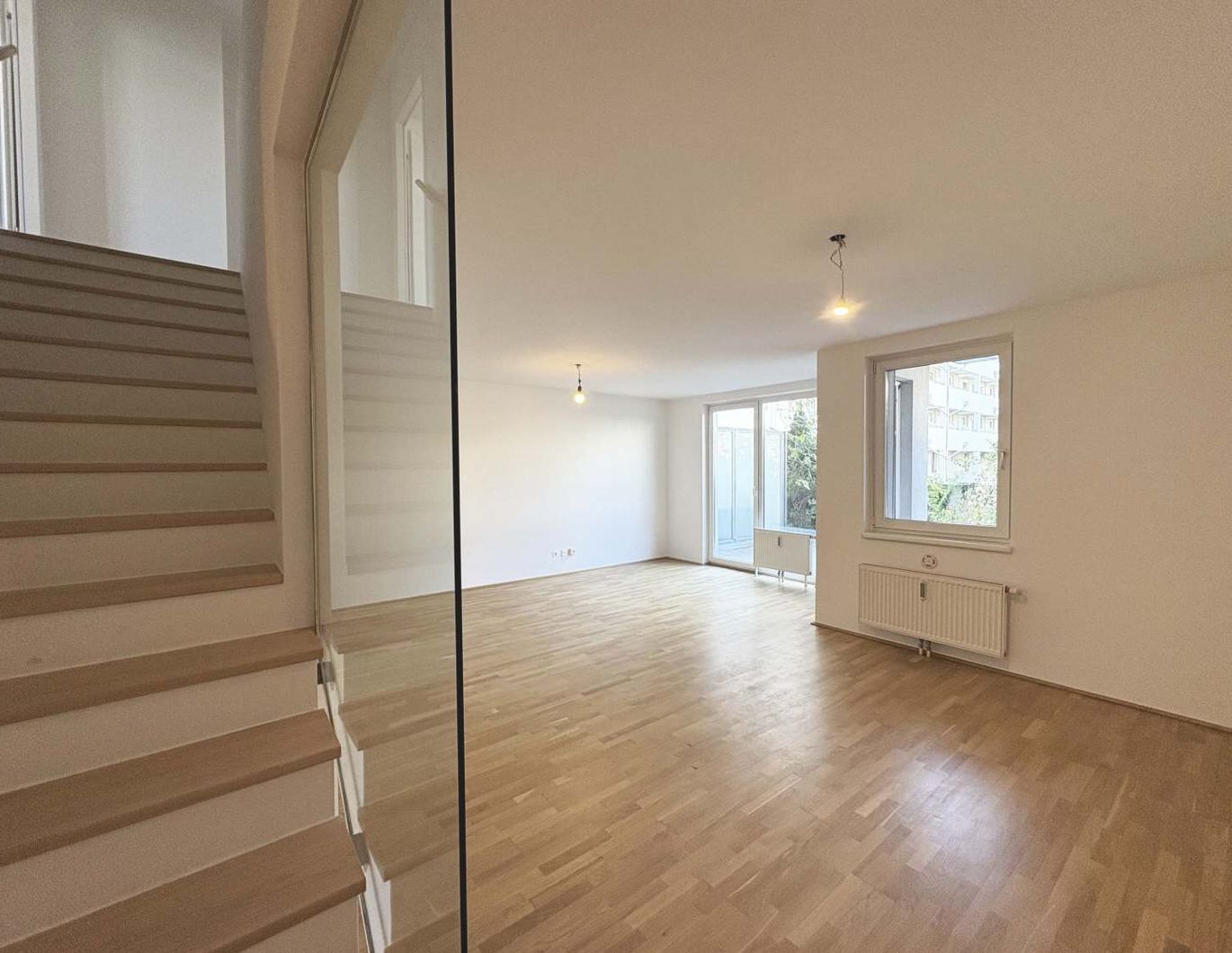 Geförderte Maisonettewohnung - 4 Zimmer mit Garten, Balkon und Loggia