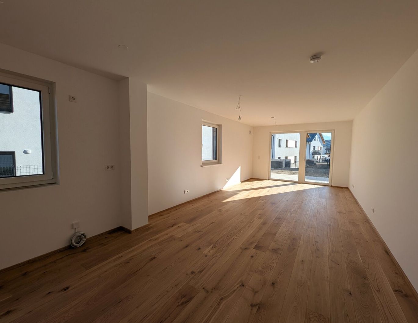 Bezugsfertig - ansprechende 3 Zimmer Erstbezugs-Gartenwohnung im Ortszentrum Hallwang!