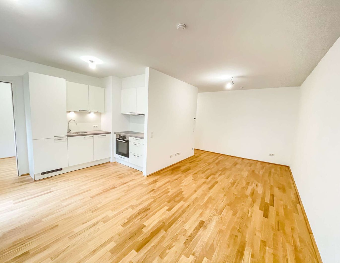 Moderne 2,5-Zimmer-Neubauwohnung mit Balkon in zentraler Ruhelage