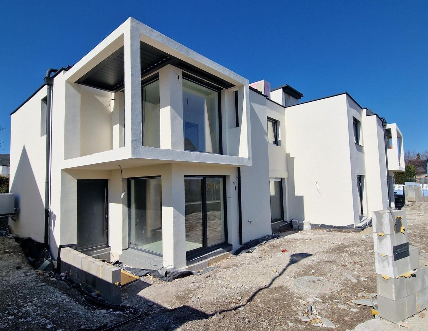 Doppelhaushälfte Neubau Top 1 - belagsfertig mit Dachterrasse!